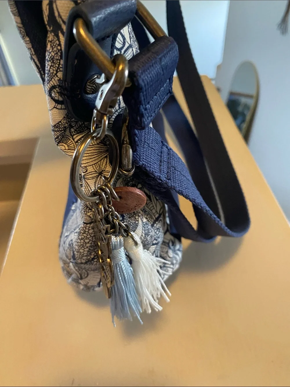 Sakroots Navy and White Floral Crossbody with Tassel Accent